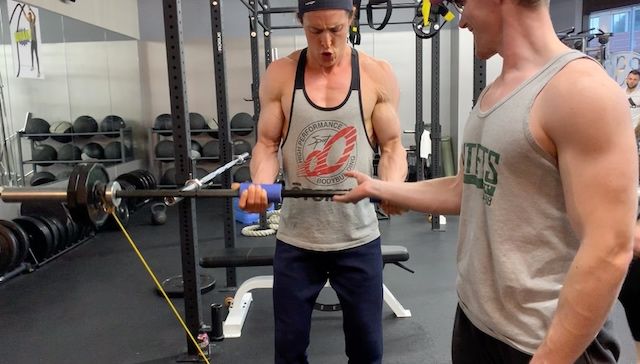 Brendon Smith doing biceps curls