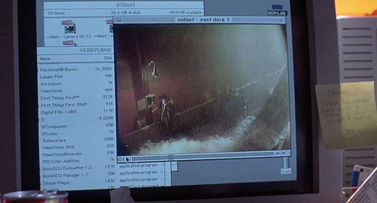 Image from Jurassic Park (1993) of Dennis Nedry's desktop showing that his hard drive is named NEDRYLAND